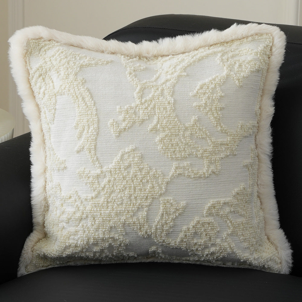 Square decorative pillow with embossed circular relief and soft faux fur edging