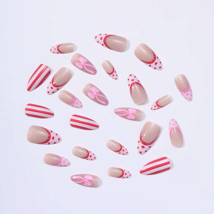 Nail set with playful bow and stripe pattern Stornfield