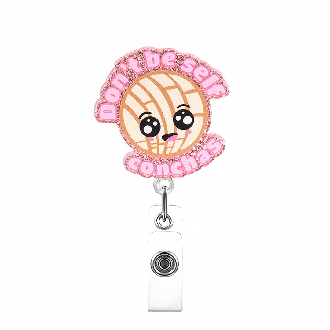 Expandable badge holder with anatomical heart pendant