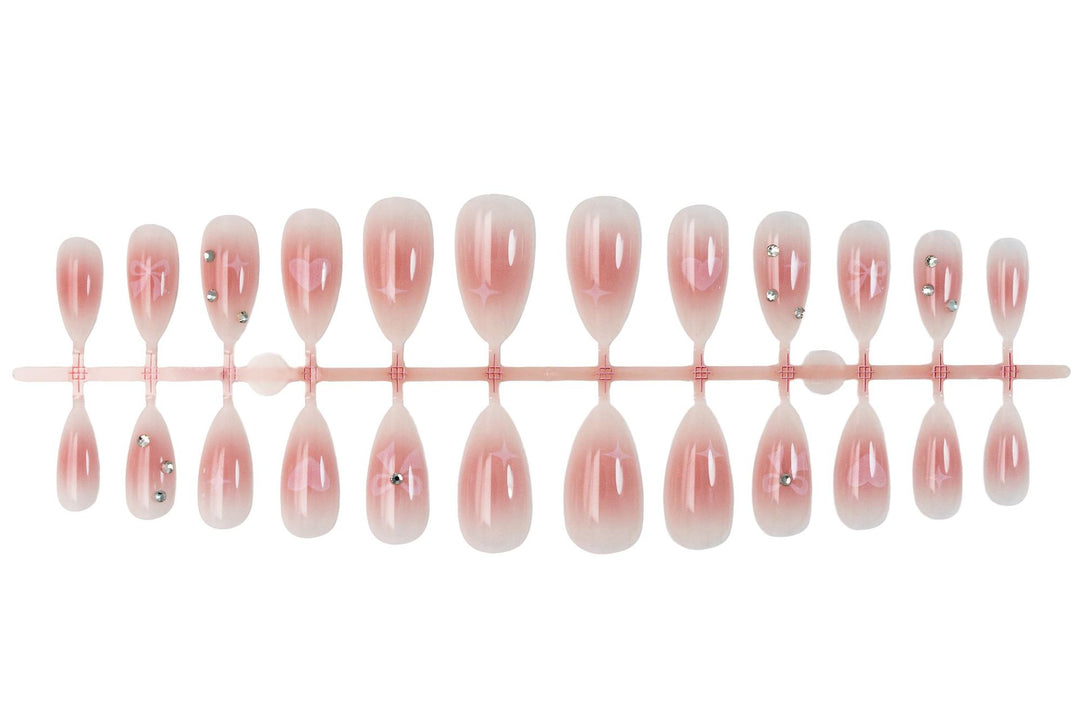 Artificial nail set with romantic heart and bow motifs Stornfield