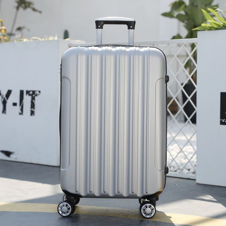 Hard shell suitcase with 360-degree wheel system and integrated safety feature Stornfield