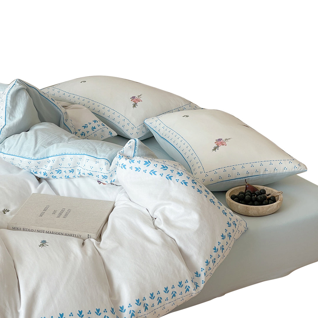 Cotton bedding set with delicate floral embroidery and decorative border