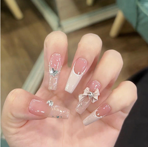 Glamorous artificial nails with moon and star motifs Stornfield