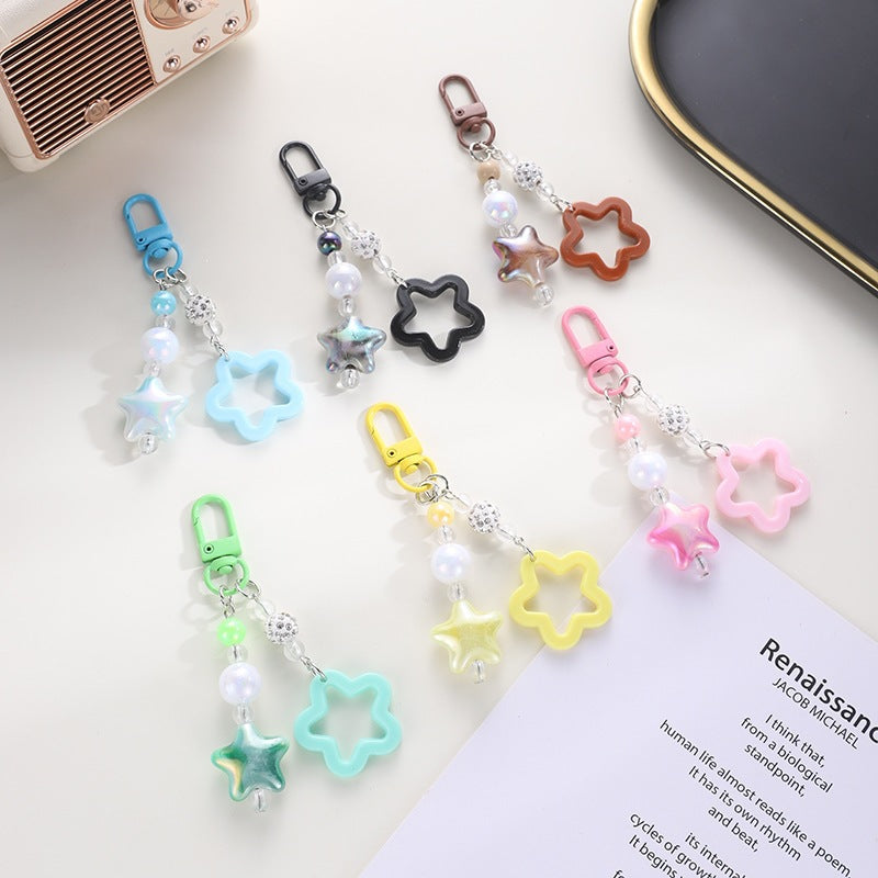 Playful keychain with floral and star motif Stornfield
