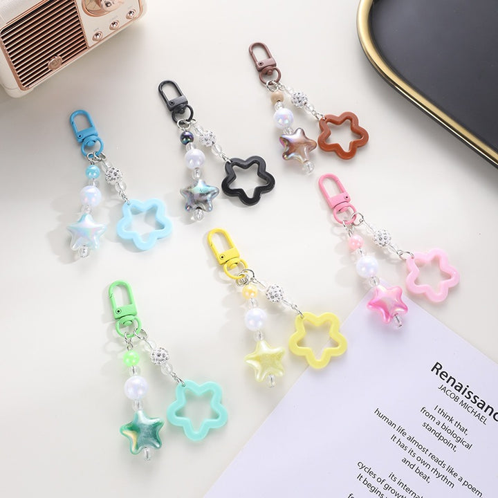 Playful keychain with floral and star motif Stornfield