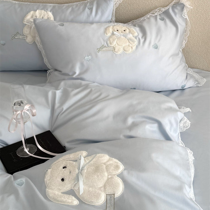 Luxurious bedding set made of cotton satin with embroidered plush bunny and lace trim