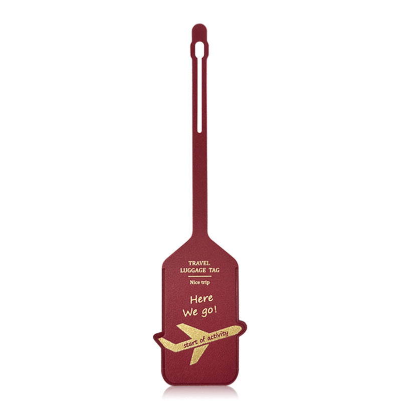 premium leather travel luggage ID tag with embossed airplane motif and adjustable strap Stornfield
