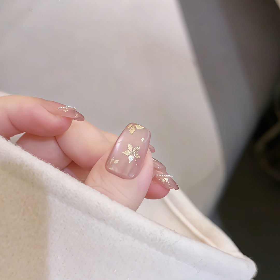 Artificial nails with elegant gold designs Stornfield