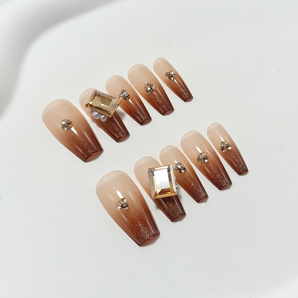Artificial nails with elegant ombre effect and exquisite gemstones Stornfield