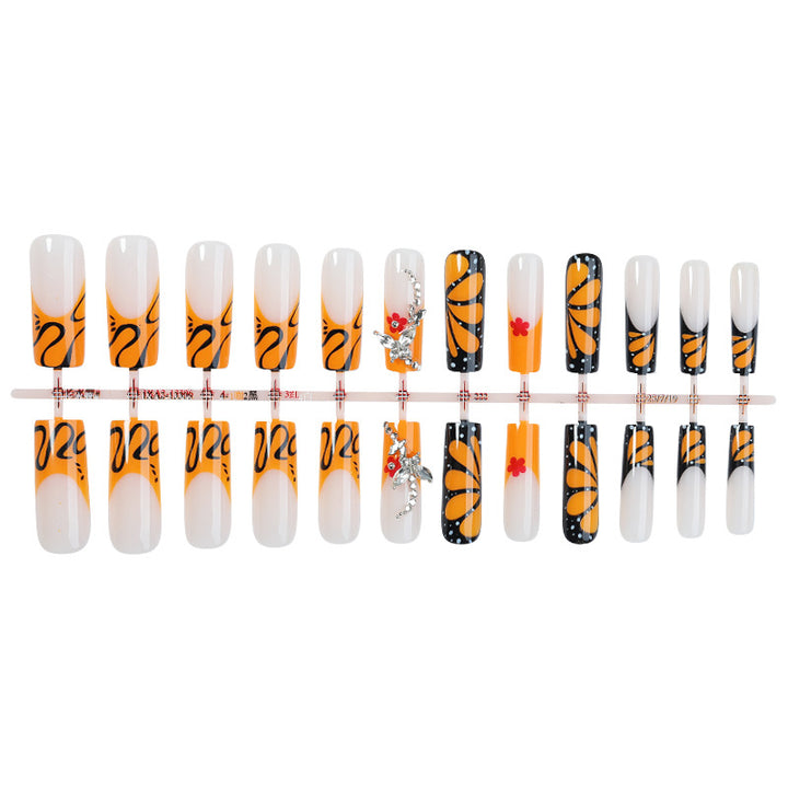 Creative nail set with shimmering floral and geometric designs Stornfield