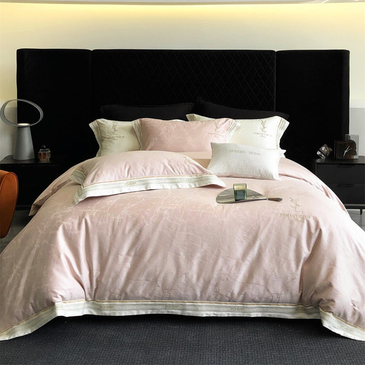 Luxurious satin bedding set with subtle marble texture and golden embroidered border
