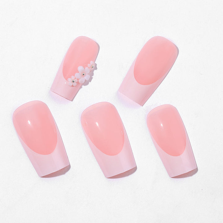 Artificial nail set with elegant French tips and hand-drawn flower motifs Stornfield