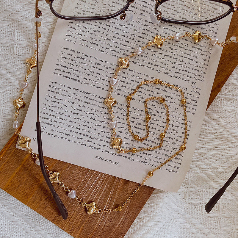 Fashionable necklace with pearls and golden accents Stornfield