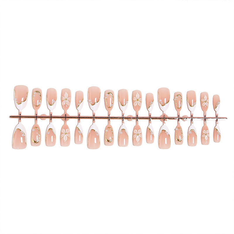 Artificial nail set with elegant floral design and glamorous 3D applications Stornfield