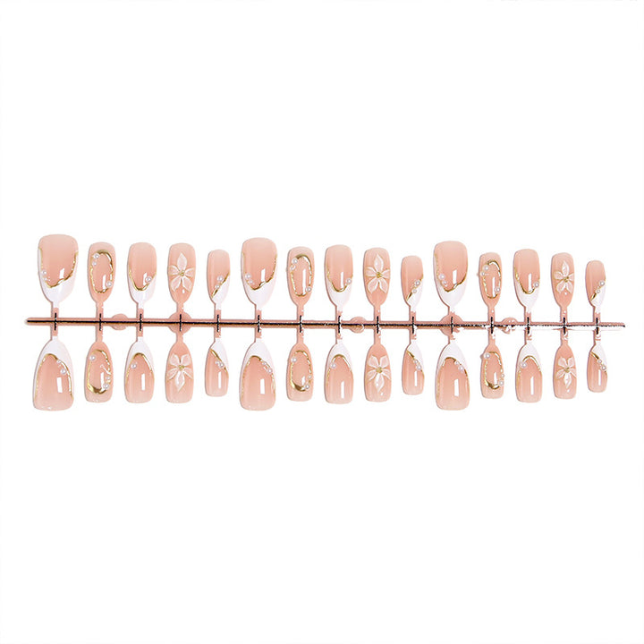 Artificial nail set with elegant floral design and glamorous 3D applications Stornfield