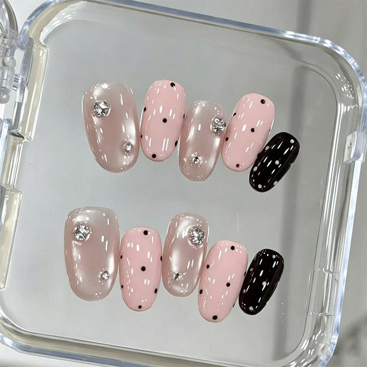 Acrylic nail set with glamorous rhinestone accents and modern dots Stornfield