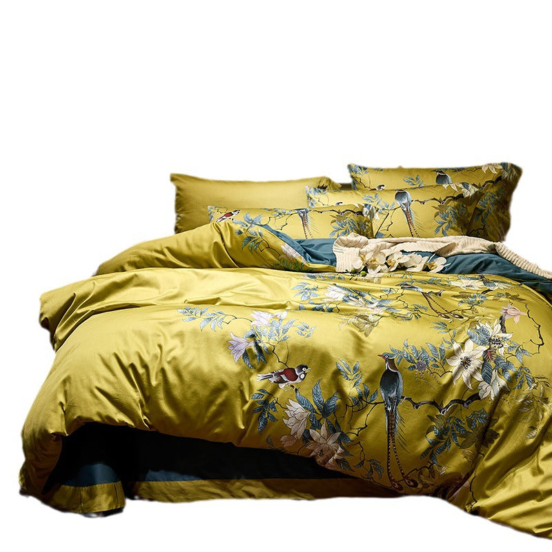 Cotton satin bedding set with watercolor flower print and reversible blanket