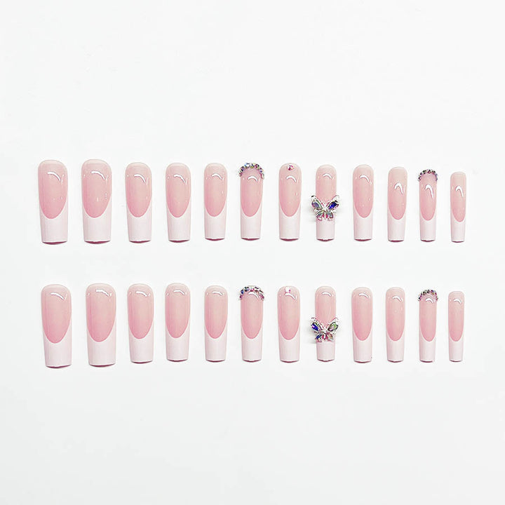 Acrylic nail set with elegant design and sparkling rhinestone accents Stornfield