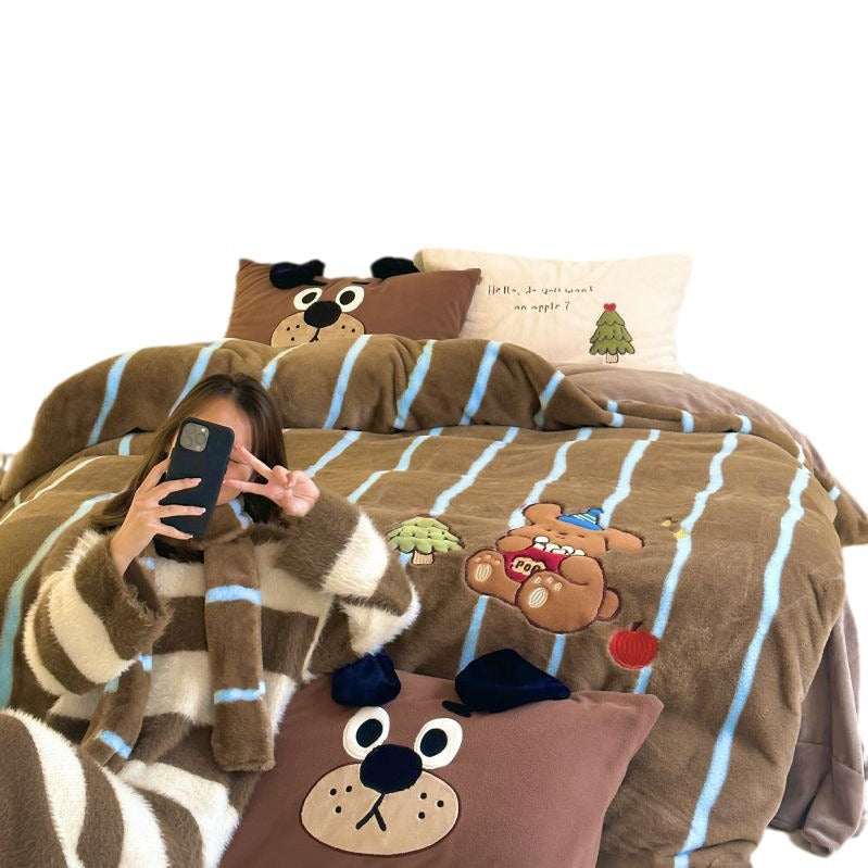 Cozy bedding and cuddly blanket set with embroidered cat appliqués