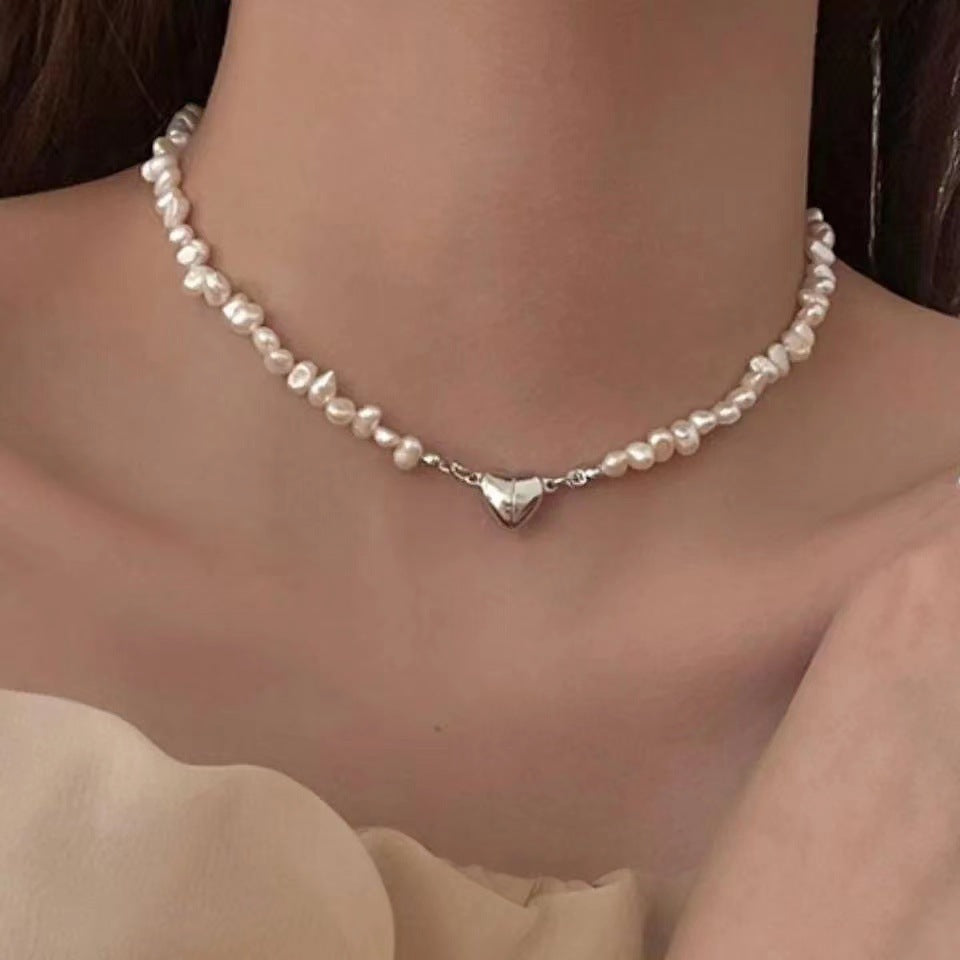 Elegant silver pearl bracelet with heart details Stornfield