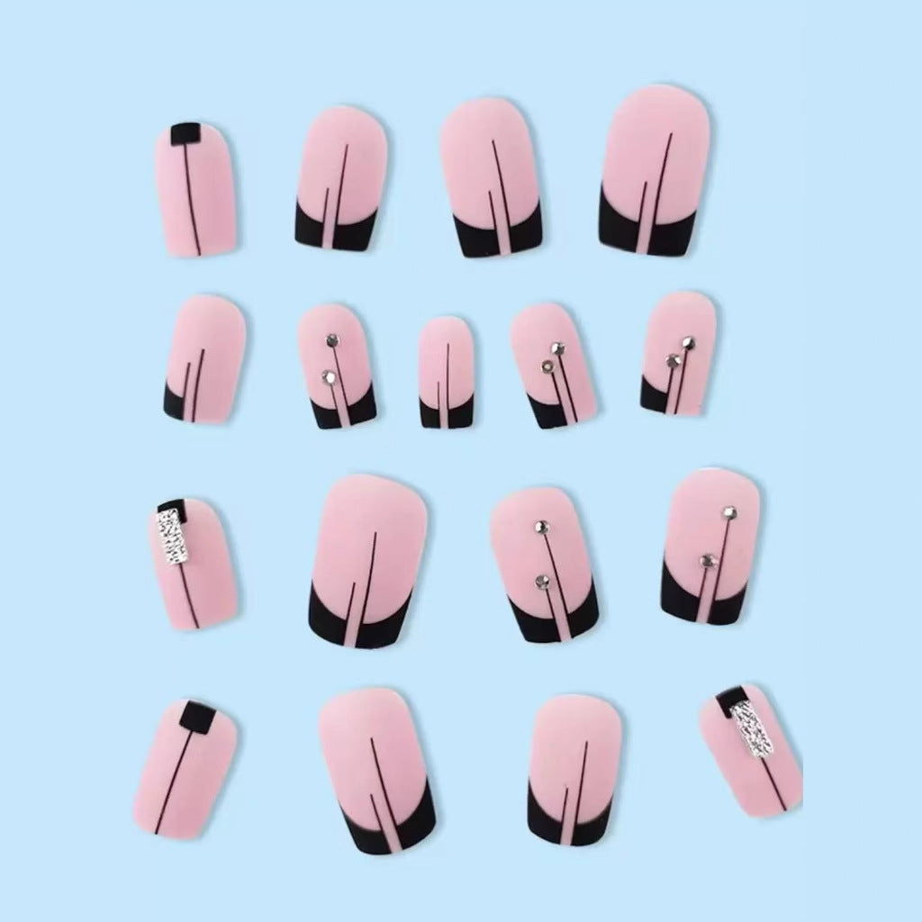Acrylic nail set with elegant rhinestone accents and stylish lines Stornfield