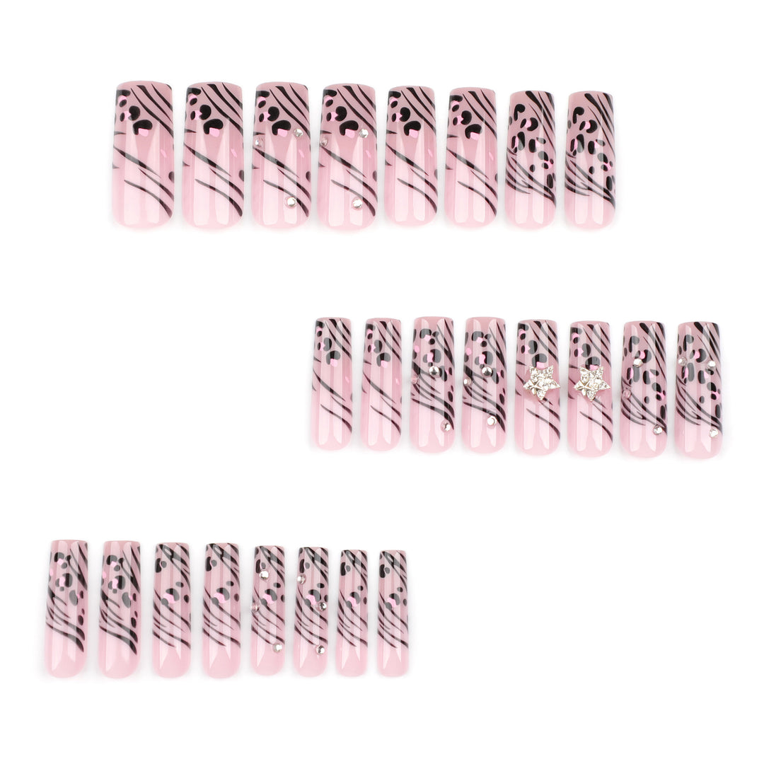 Artful Nail Art with Zebra Pattern and Glitter Accents Stornfield
