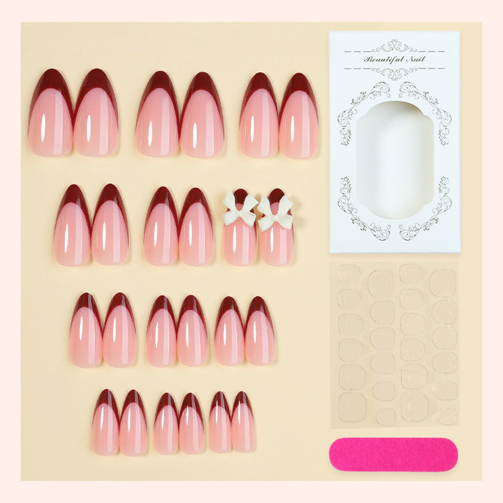 Acrylic nail set with creative French tip design and cute bows Stornfield