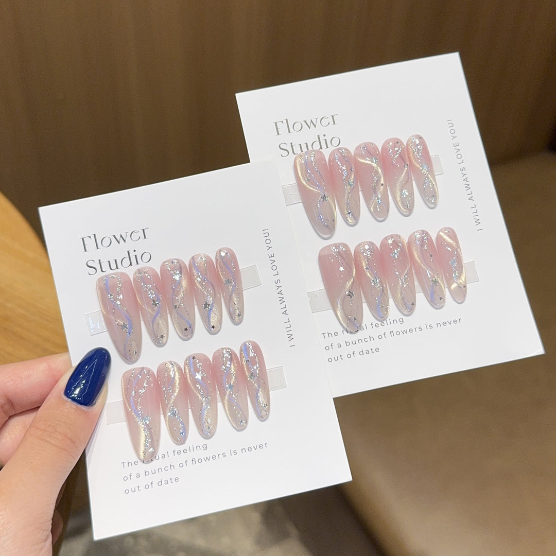 Artificial nails with sparkling floral pattern and sculptural accents Stornfield