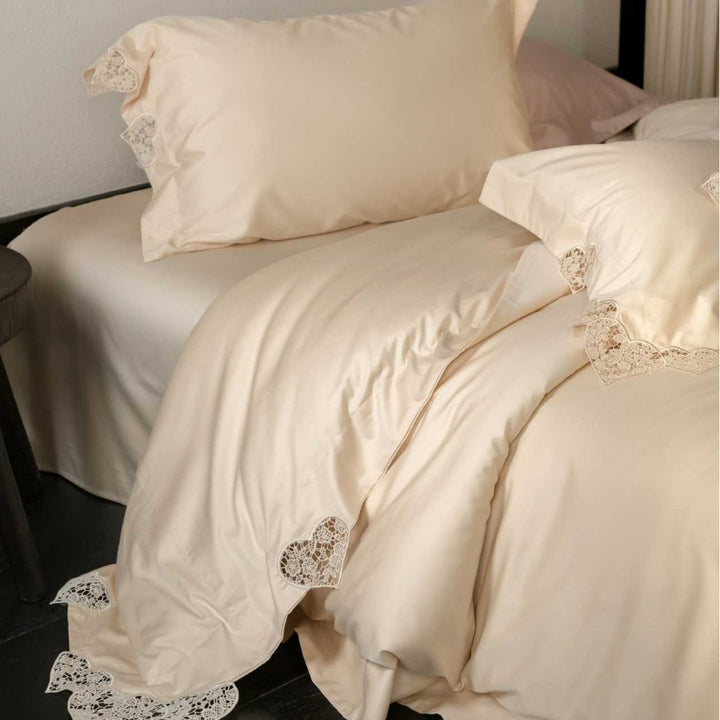 Satin bedding set with lace heart appliqué