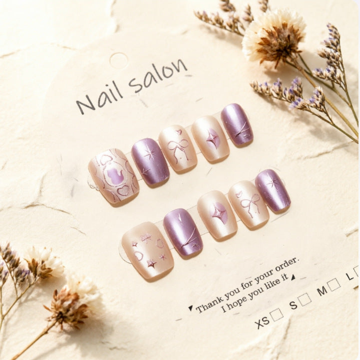 Artificial nails with playful bow and star design Stornfield