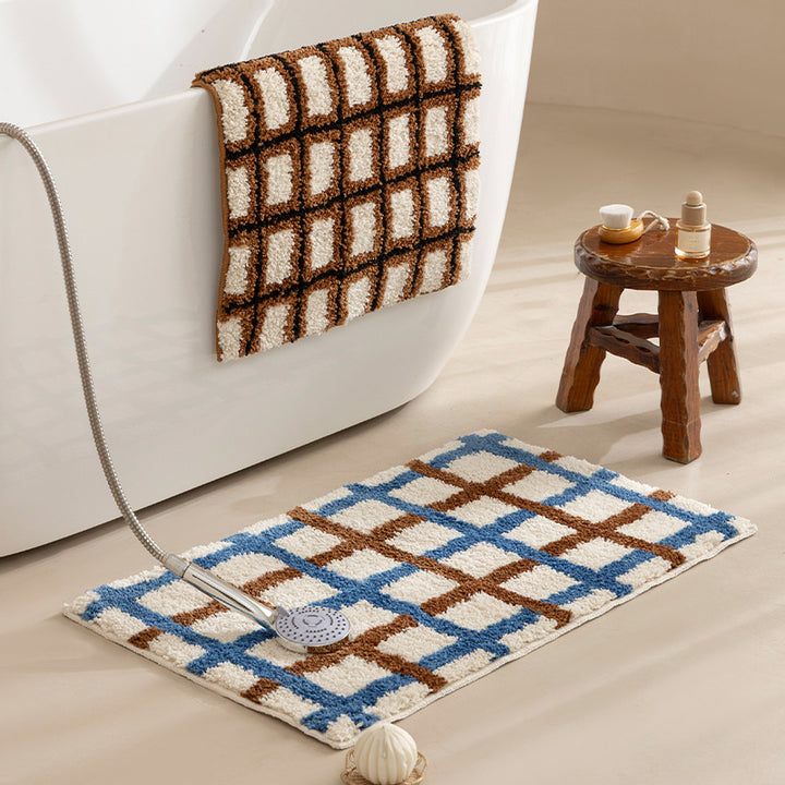 Short pile bath mat with geometric check pattern and non-slip backing Stornfield