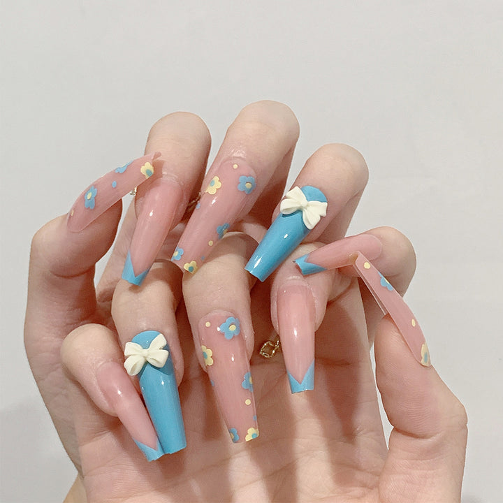 Artistic and playful nail extensions with floral patterns Stornfield