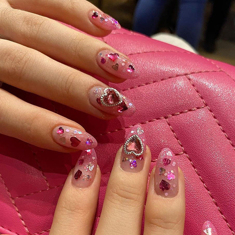Artful nail art with playful heart designs and glitter Stornfield