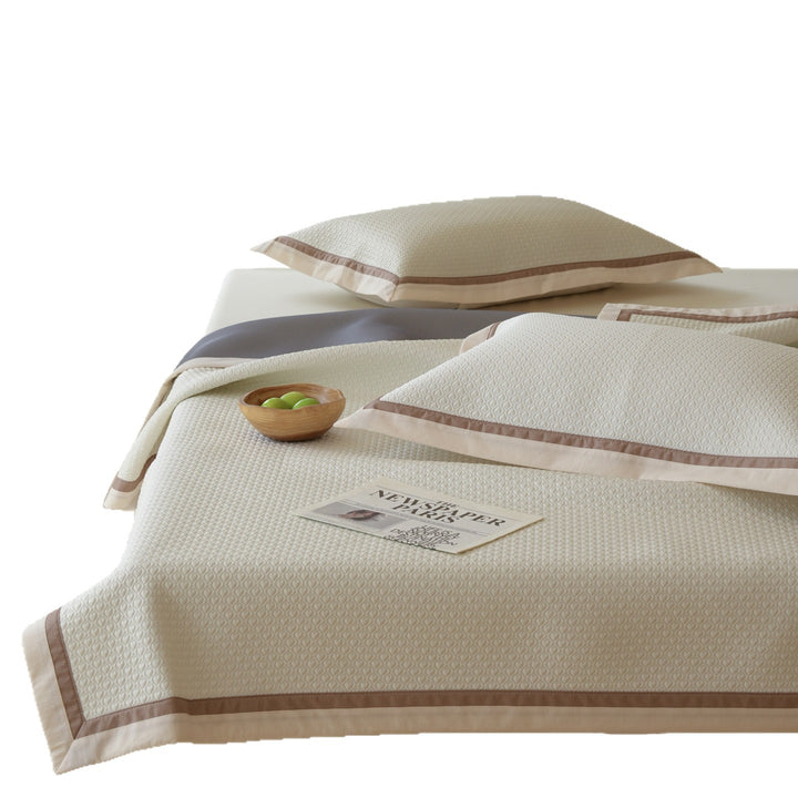 Quilted bedspread with textured waffle pattern and pillowcases