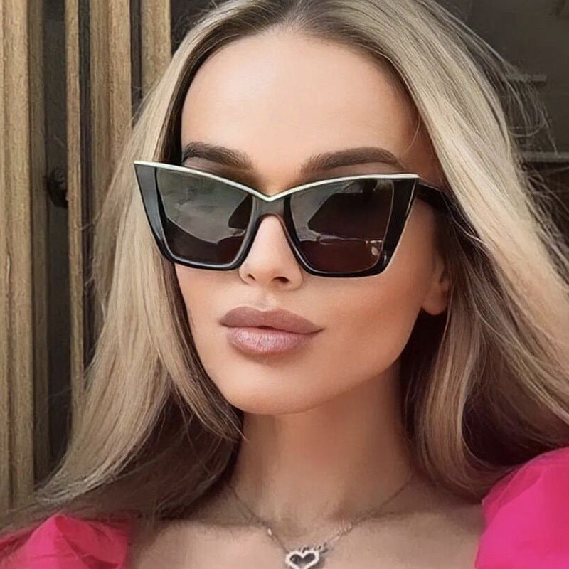 Women extravagant sunglasses with unique design and golden accents Stornfield