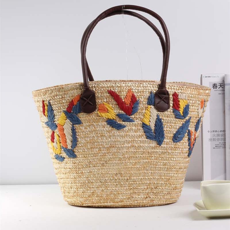 Braided beach bag with colorful embroidery pattern Stornfield