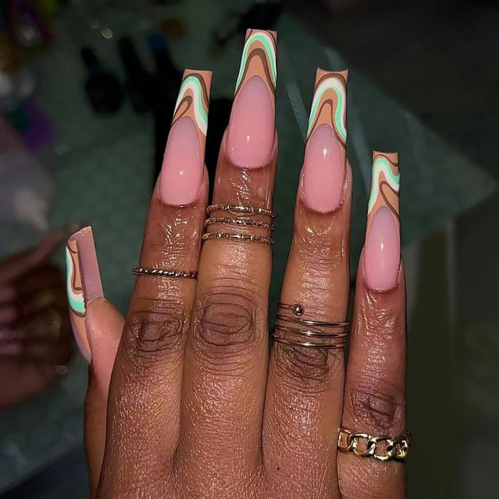 Artful acrylic nails with elegant wave design Stornfield