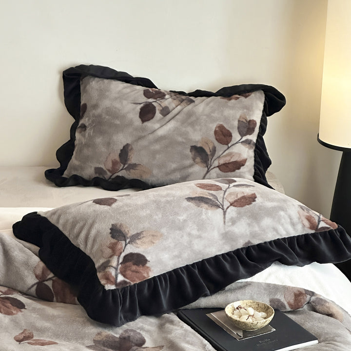 Plush bedding set made of faux fur with cow print design and contrasting ruffles