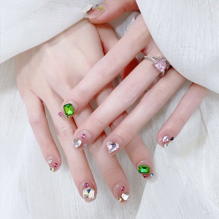 Acrylic nail set with sparkling 3D applications and beautiful heart designs Stornfield