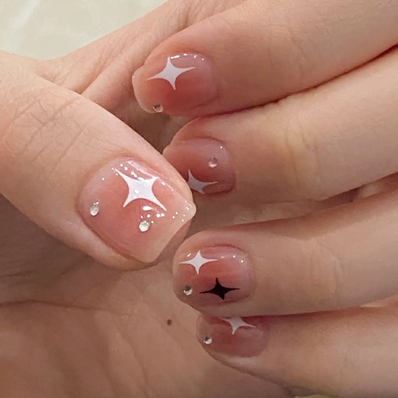Acrylic nail set with sparkling star decorations and elegant accents Stornfield