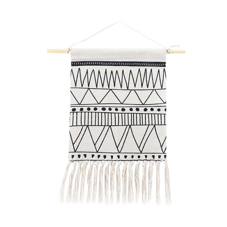 Woven Boho wall hanging with fringes and graphic ethnic pattern Stornfield