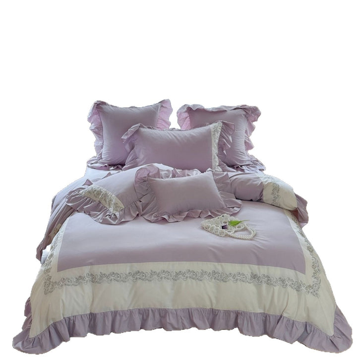Designer bed linen set with ruffle hem and fine border embroidery