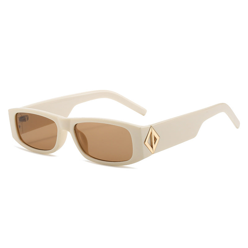 Ladies fashionable sunglasses with asymmetrical frame and gold-colored details Stornfield