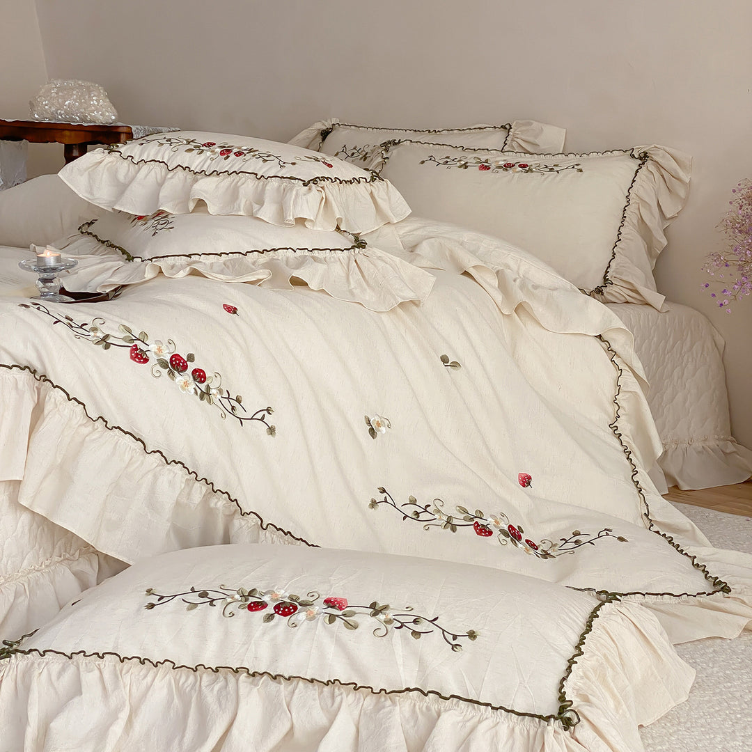 Country house style embroidered bedding set with strawberry motif and ruffle
