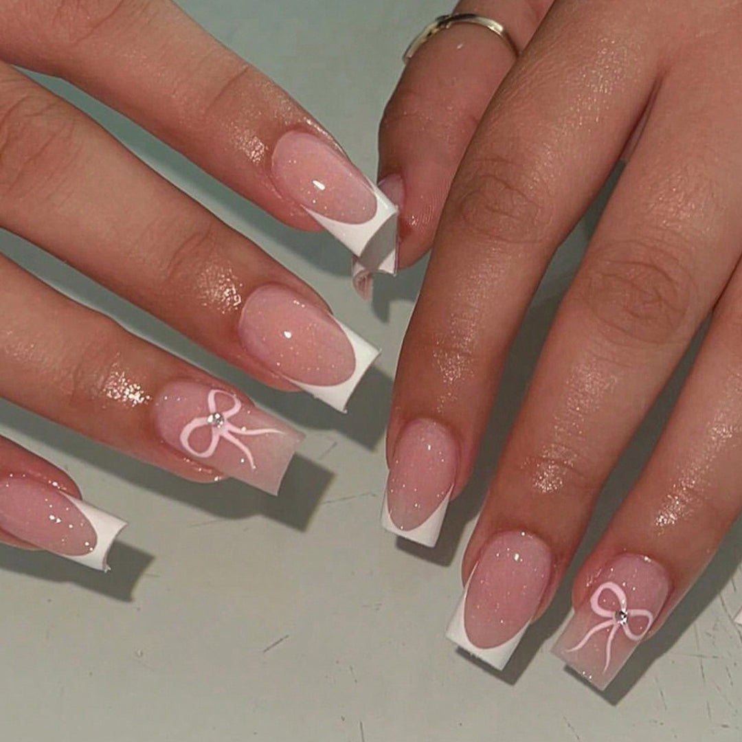 Nail art set with elegant bow and glitter accents Stornfield
