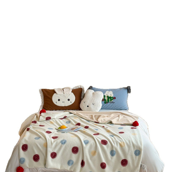 Reversible cuddly blanket made of teddy fleece and microfleece with floral pattern and fastening straps
