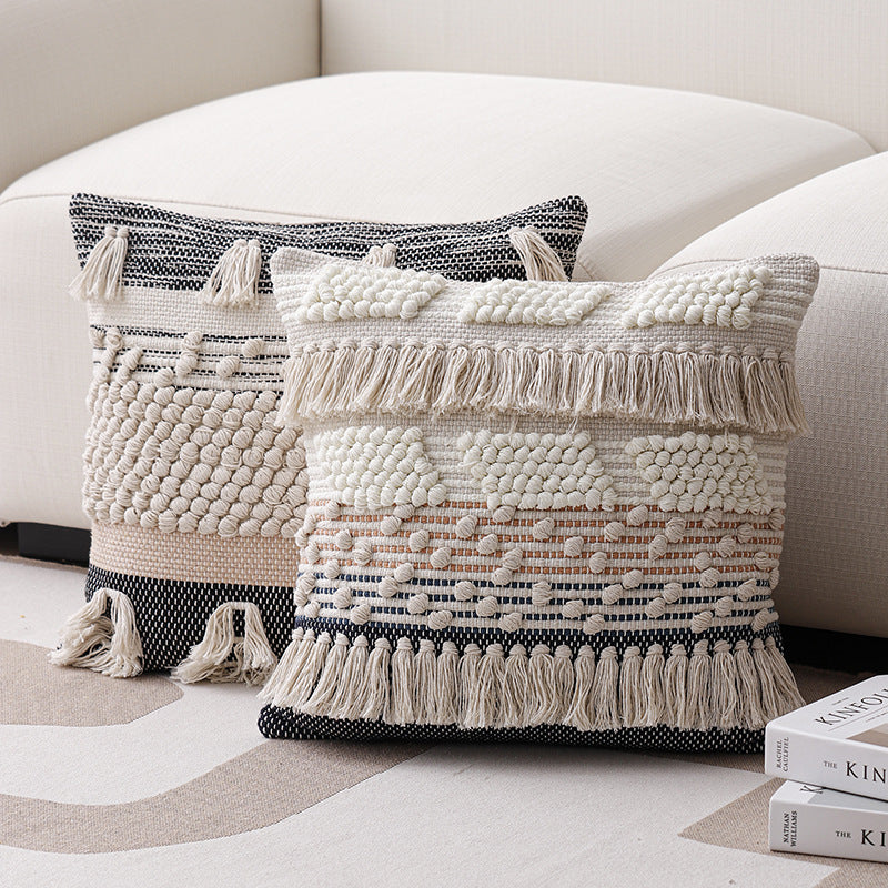 High-structured woven decorative cushion cover with fringes and bouclé application