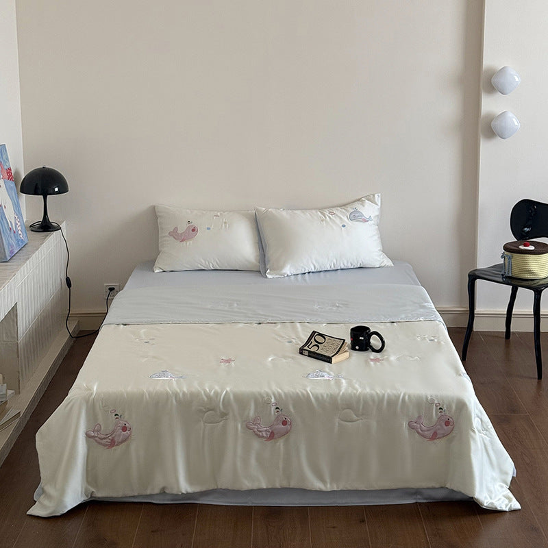 Satin bedding set with playful whale print and silky shiny surface