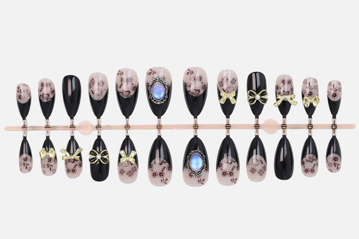 Artificial nail set with elegant dot and bow decorations Stornfield