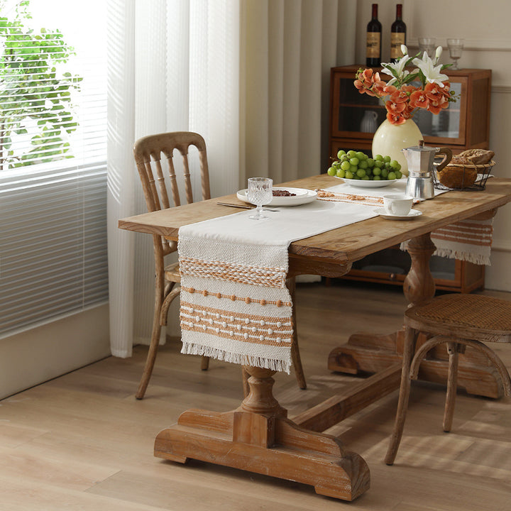 Woven cotton table runner with fringes and textured pattern Stornfield